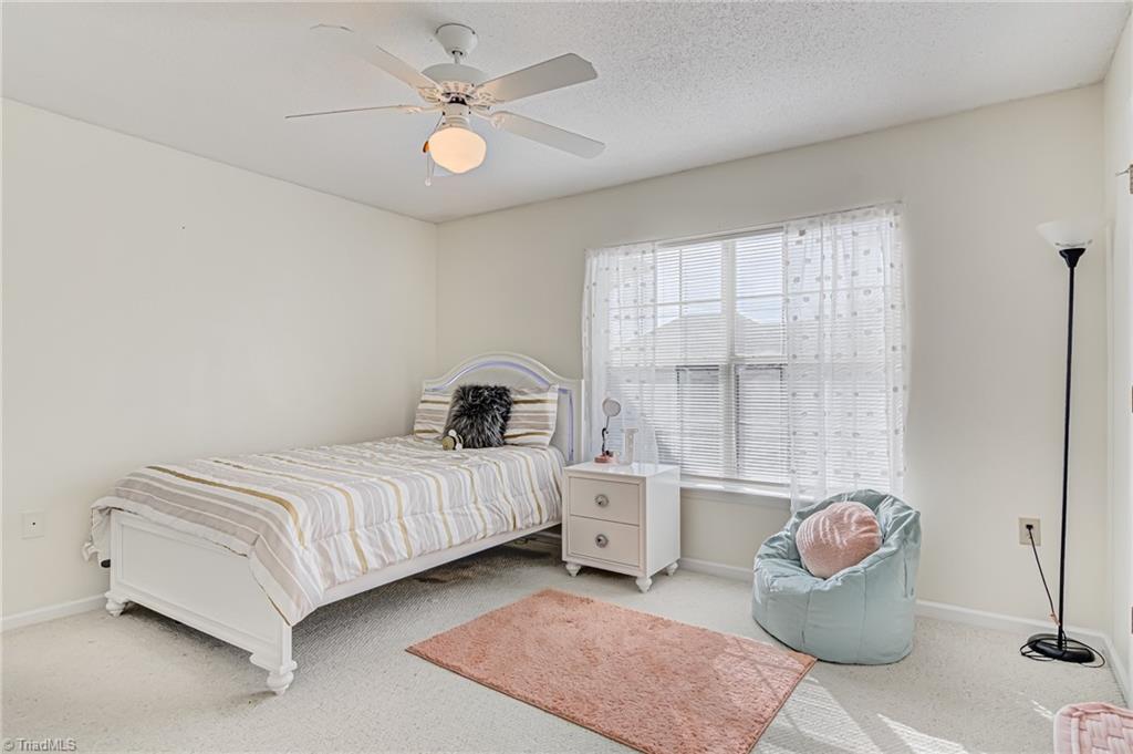 2640 Ingleside Drive, Unit 2D High Point, NC 27265 - Photo 16 of 27 Second bedroom with large window and ceiling fan.