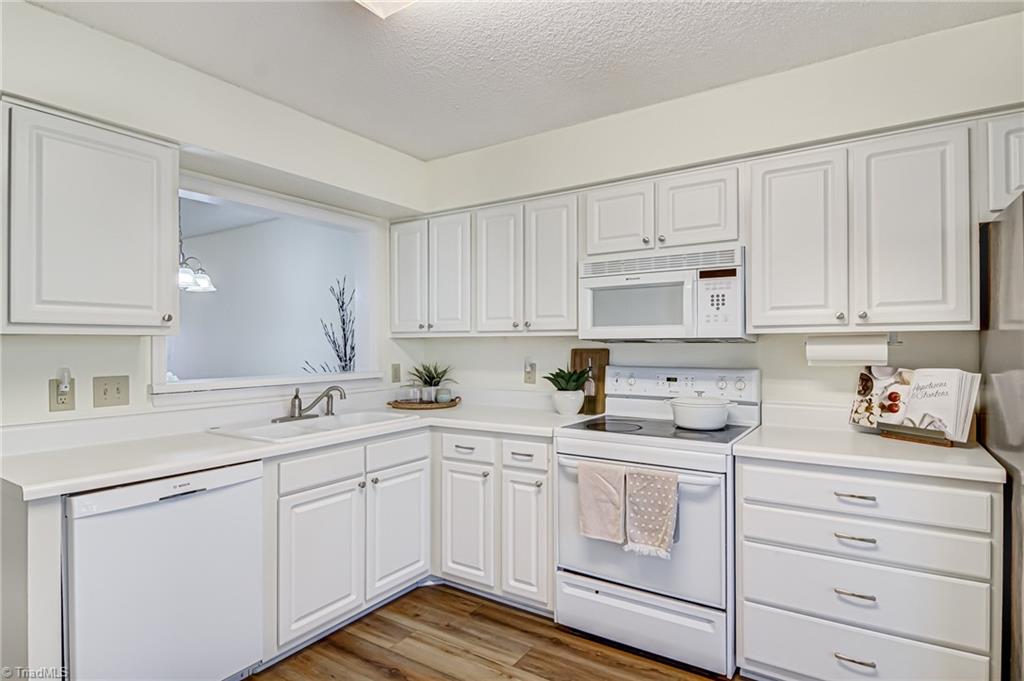 2640 Ingleside Drive, Unit 2D High Point, NC 27265 - Photo 8 of 27 Kitchen overlooks the dining and living room.