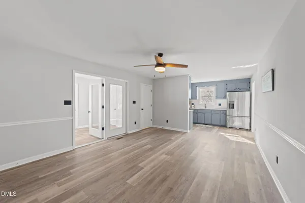 a bathroom with a granite countertop sink a toilet and a mirror