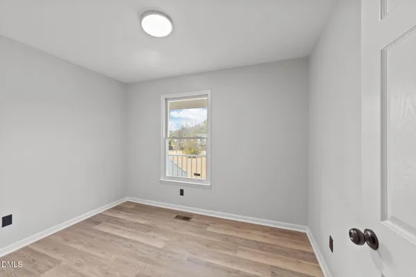 a view of an empty room and window