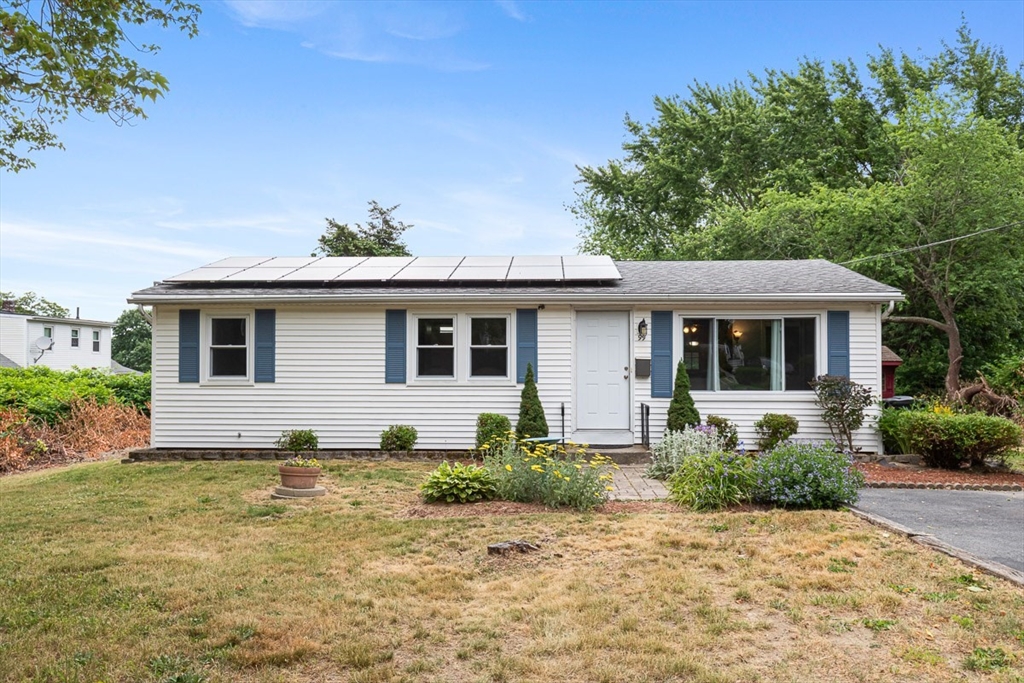99 Swansom Road Swansea, MA 02777 - Photo 3 of 42 a front view of a house with a garden