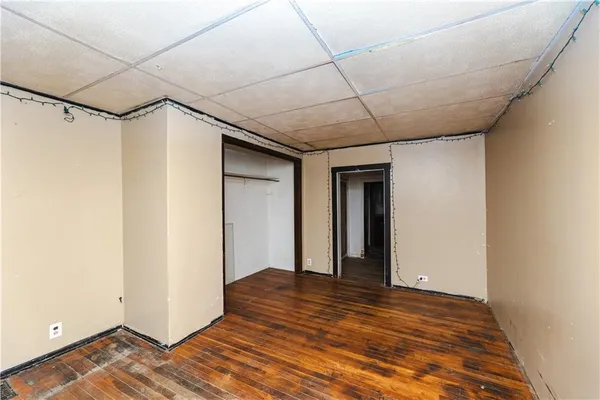 a view of hallway with wooden floor