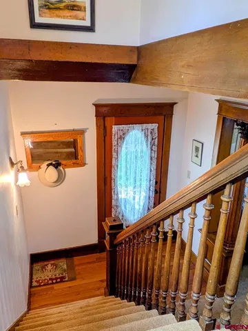 a view of a door and wooden floor