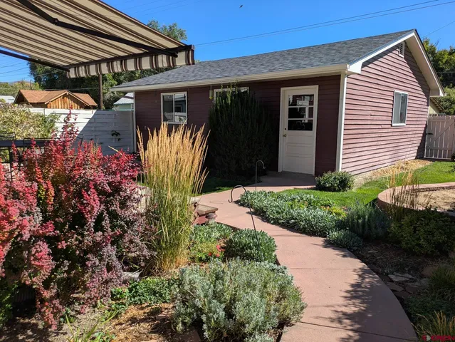 a view of a back yard of the house