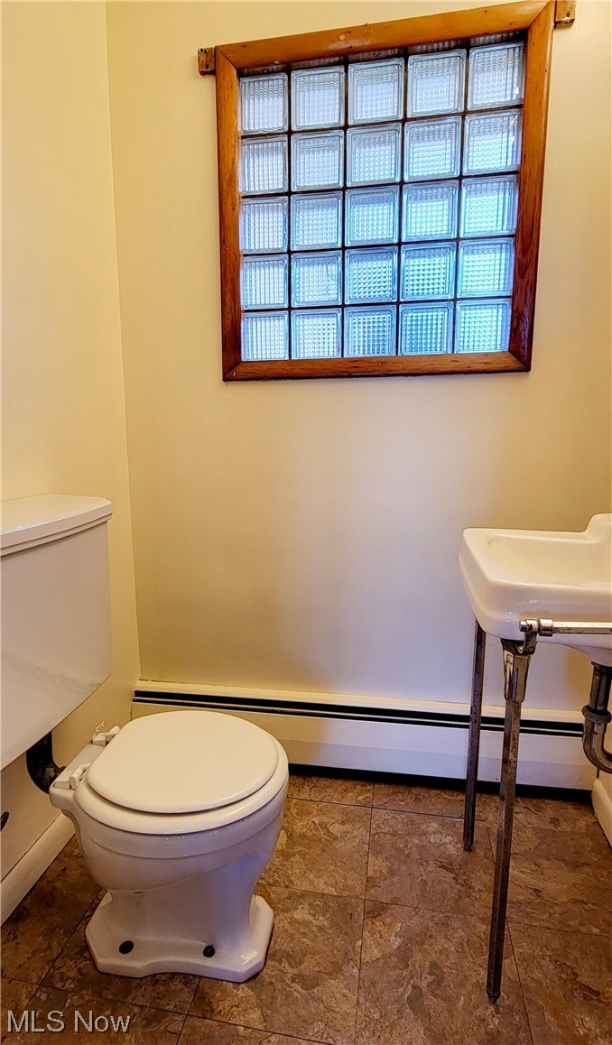 405 Bryan Road Milan, OH 44846 - Photo 22 of 35 Bathroom with toilet, linoleum floors, and sink