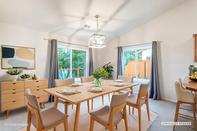 a view of a dining room with furniture window and outside view