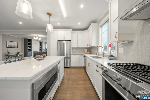 a bathroom with a sink toilet and a mirror