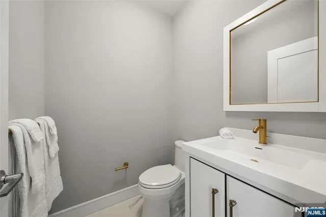 a view of a hallway with windows and stairs