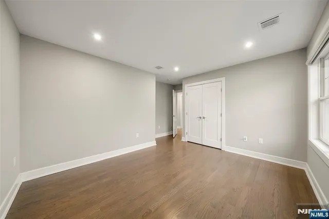 a view of a balcony with wooden floor