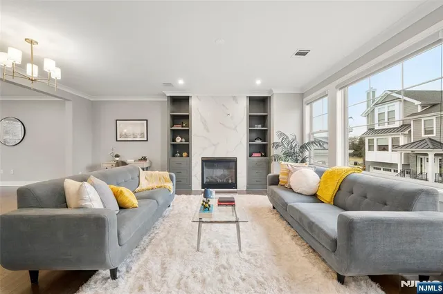 a living room with furniture and a fireplace