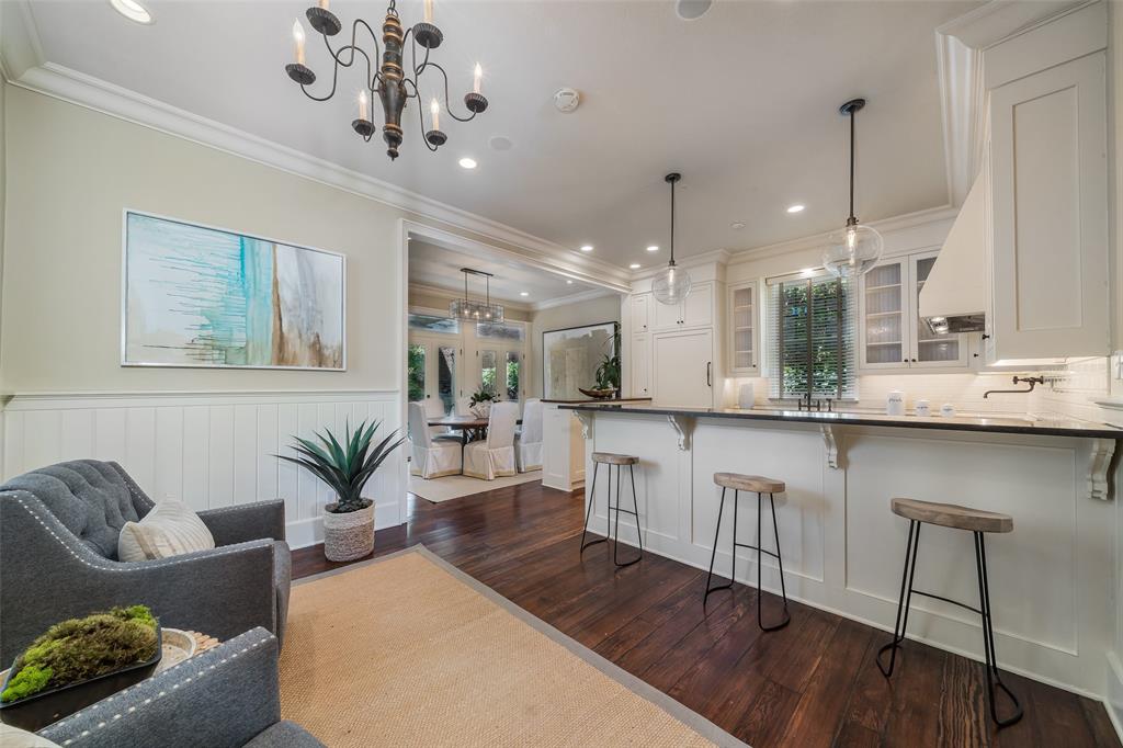2315 Routh Street Dallas, TX 75201 - Photo 10 of 38 a large kitchen with a table and chairs