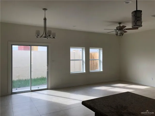 a view of an empty room with windows