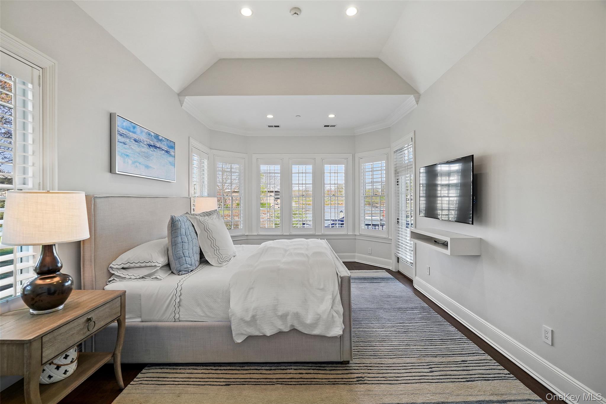 680 Milton Road Rye, NY 10580 - Photo 12 of 32 a bedroom with a bed and a flat screen tv