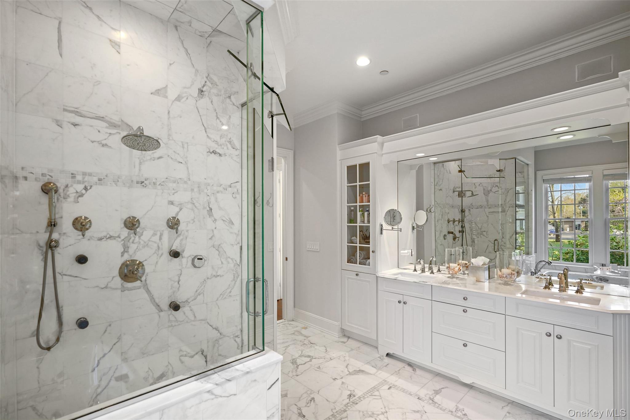 680 Milton Road Rye, NY 10580 - Photo 13 of 32 a bathroom with a double vanity sink mirror and shower