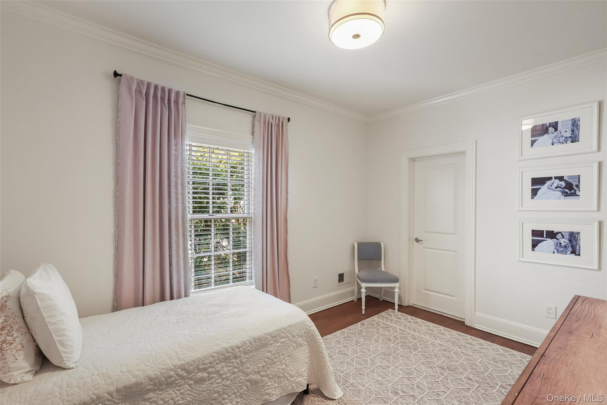 680 Milton Road Rye, NY 10580 - Photo 16 of 32 a bedroom with a bed and a window