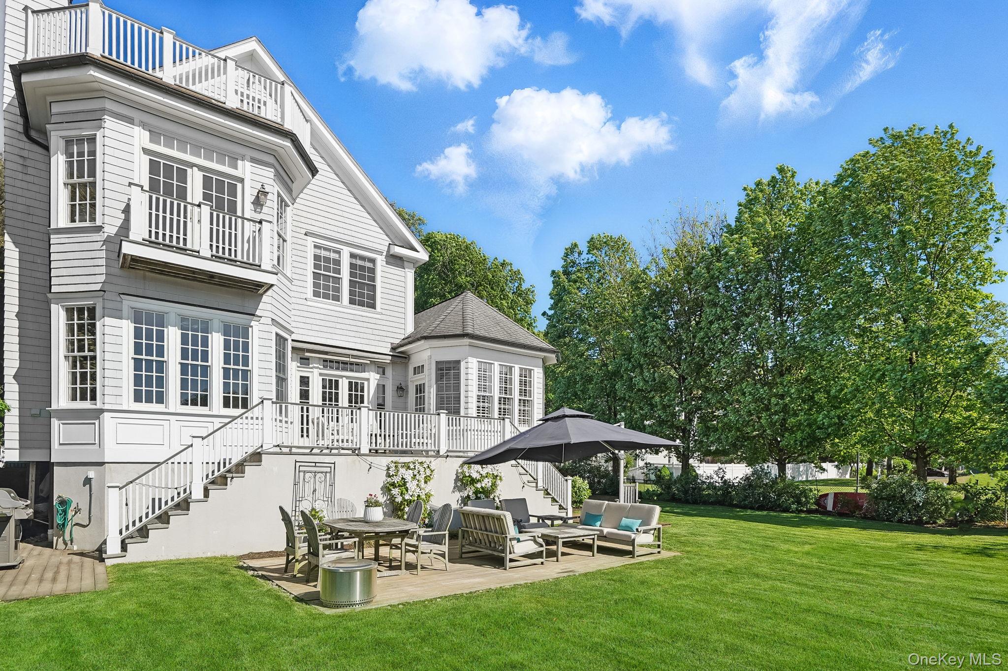 680 Milton Road Rye, NY 10580 - Photo 23 of 32 a swimming pool with outdoor seating and yard