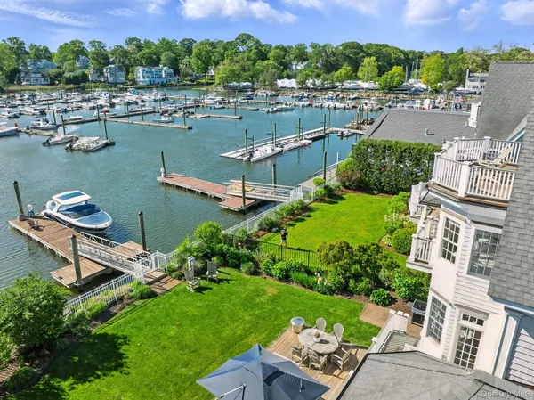 an aerial view of a house with a lake view