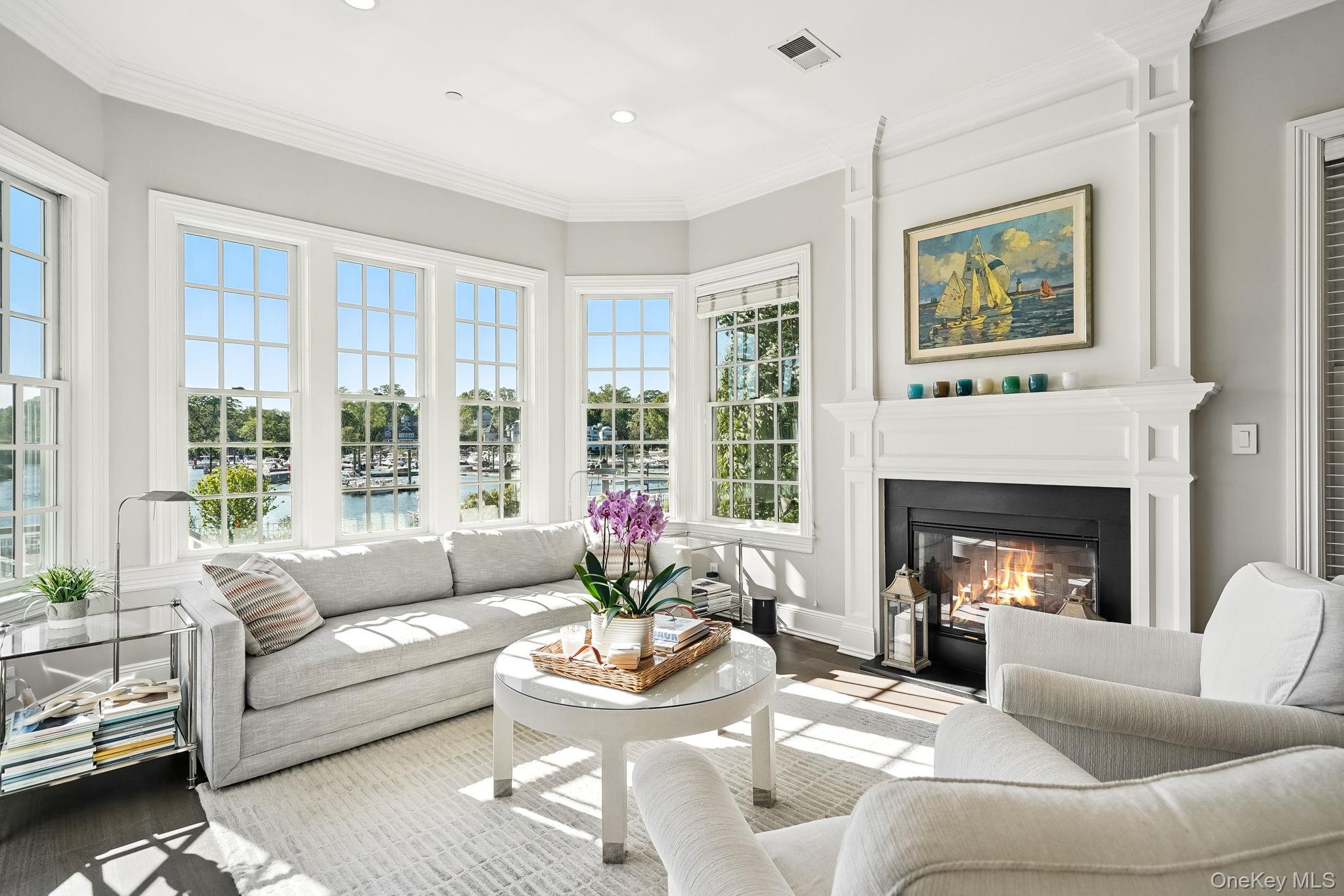 680 Milton Road Rye, NY 10580 - Photo 9 of 32 a living room with furniture and a fireplace