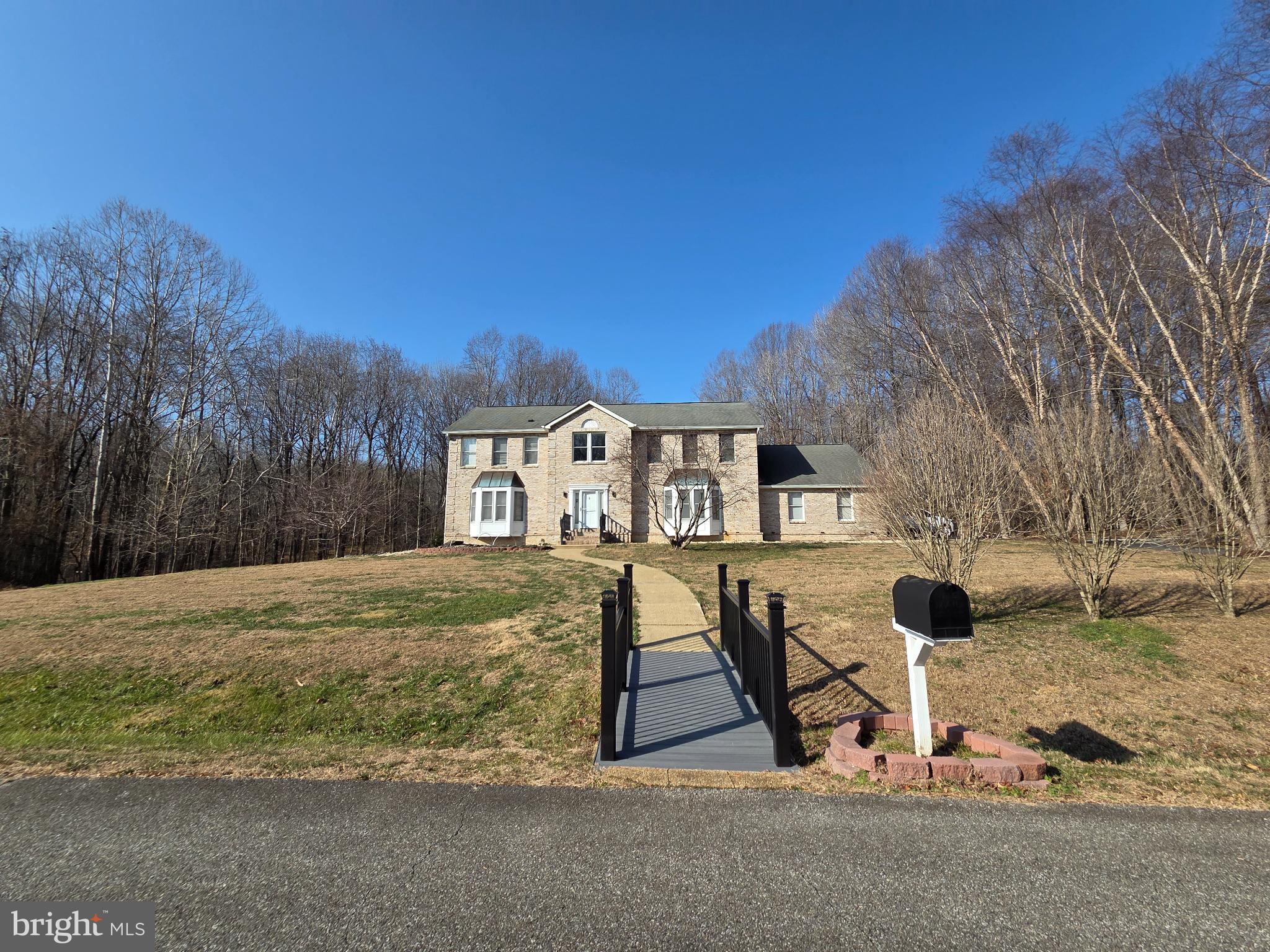 Charming stone home on serene landscape.