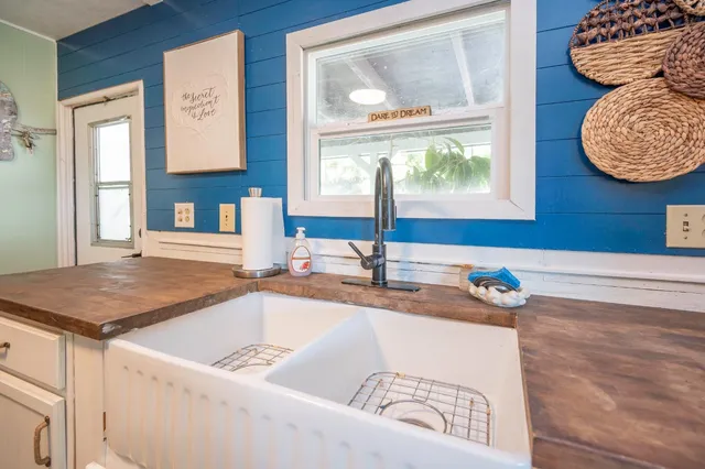 a view of a livingroom with furniture a flat screen tv