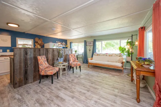 a view of a porch with wooden floor