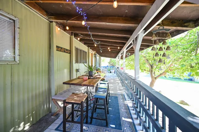 a view of a yard with swimming pool