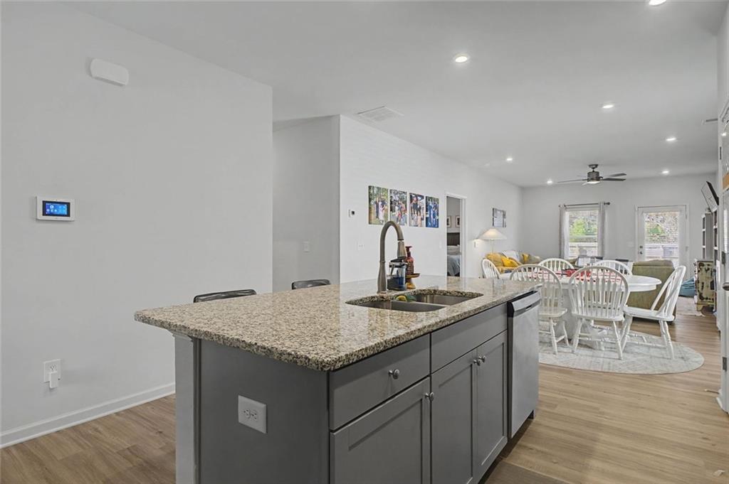 213 Sycamore Drive Calhoun, GA 30701 - Photo 12 of 44 a dining hall with stainless steel appliances granite countertop a stove and a sink