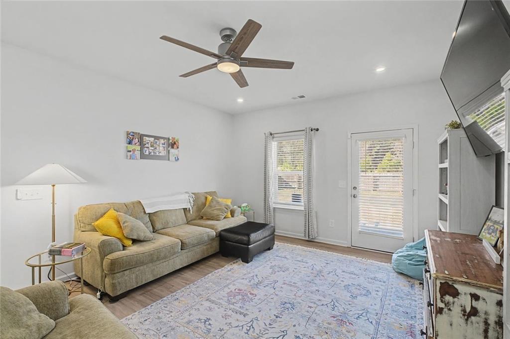 213 Sycamore Drive Calhoun, GA 30701 - Photo 17 of 44 a living room with furniture and a window