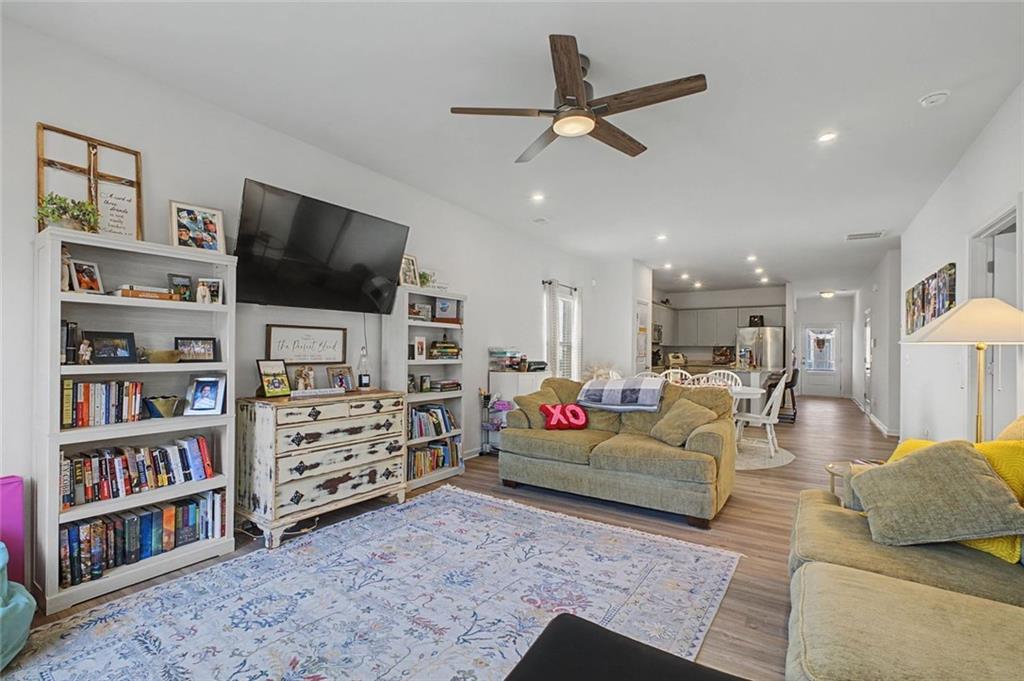 213 Sycamore Drive Calhoun, GA 30701 - Photo 18 of 44 a living room with furniture and a flat screen tv