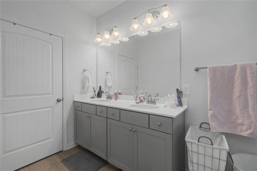 213 Sycamore Drive Calhoun, GA 30701 - Photo 30 of 44 a bathroom with a double vanity sink and a mirror