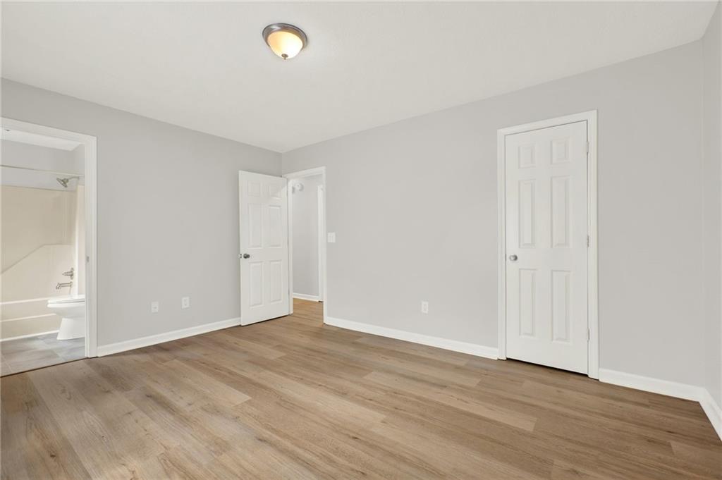 76 Picklesimer Road Southwest Cartersville, GA 30120 - Photo 29 of 43 a view of an empty room with wooden floor