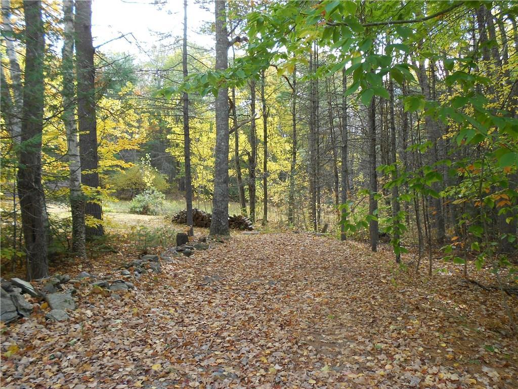 391 Kennebec Road Hampden, ME 04444 - Photo 33 of 35 Driving path to back lawn and back...
