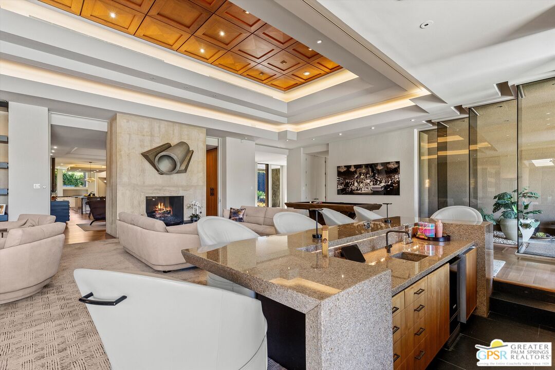 4 Big Sioux Road Rancho Mirage, CA 92270 - Photo 13 of 75 a living room with furniture and a fireplace