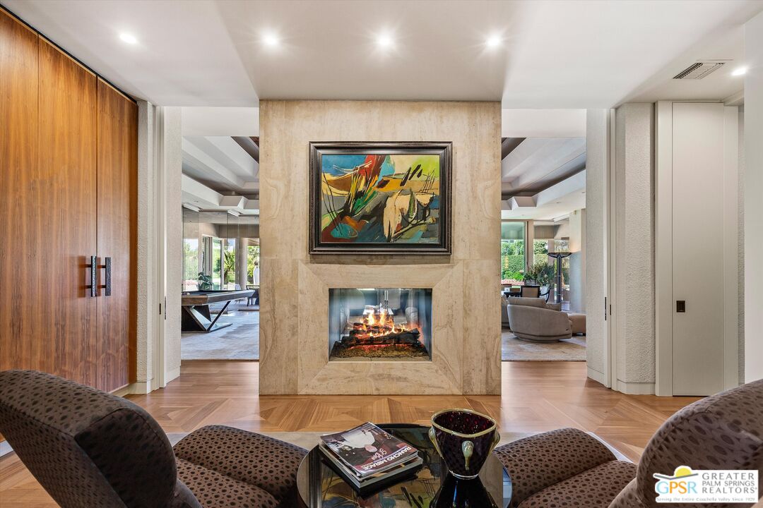 4 Big Sioux Road Rancho Mirage, CA 92270 - Photo 20 of 75 a living room with furniture and a fireplace