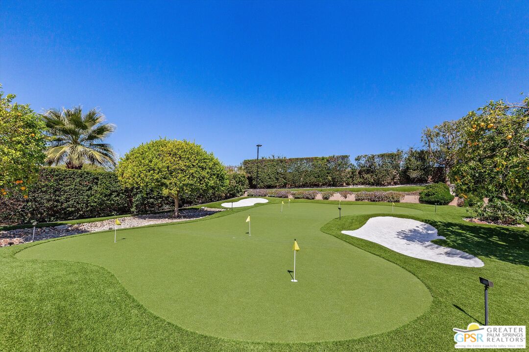 4 Big Sioux Road Rancho Mirage, CA 92270 - Photo 33 of 75 a view of a swimming pool with a yard