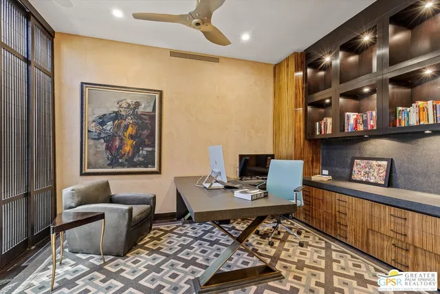 a bedroom with a bed and a painting on the wall