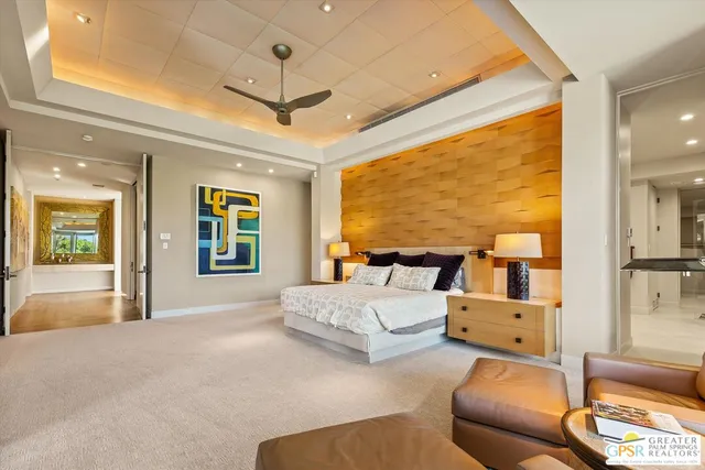 a bathroom with a granite countertop sink a mirror and shower