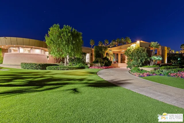 a building outdoor space with patio furniture and potted plants