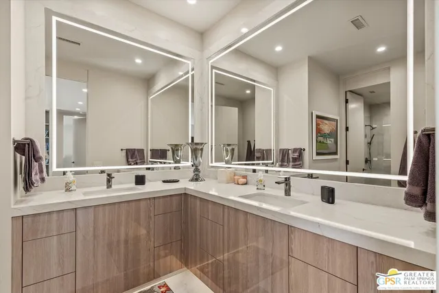 a view of a patio with table and chairs under an umbrella