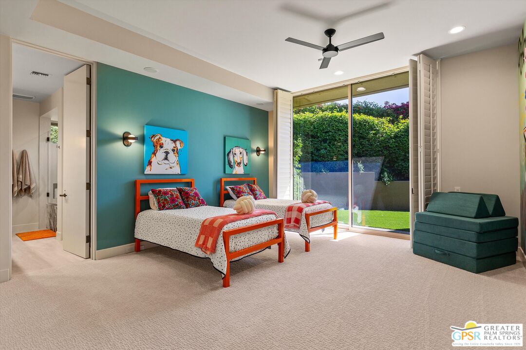 4 Big Sioux Road Rancho Mirage, CA 92270 - Photo 49 of 75 a bedroom with a bed and large windows