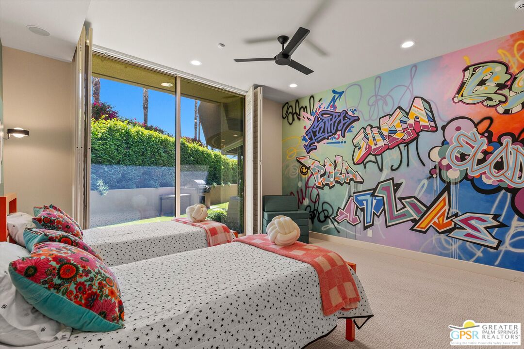 4 Big Sioux Road Rancho Mirage, CA 92270 - Photo 50 of 75 a bedroom with a bed and a painting on the wall