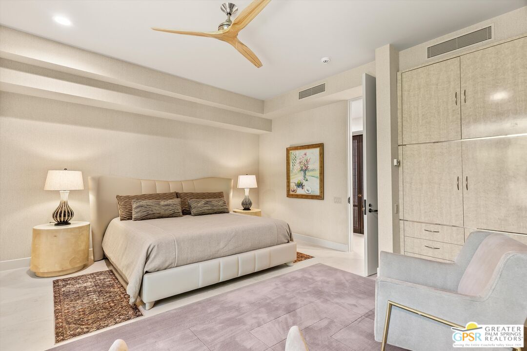 4 Big Sioux Road Rancho Mirage, CA 92270 - Photo 54 of 75 a bedroom with a bed and a chandelier