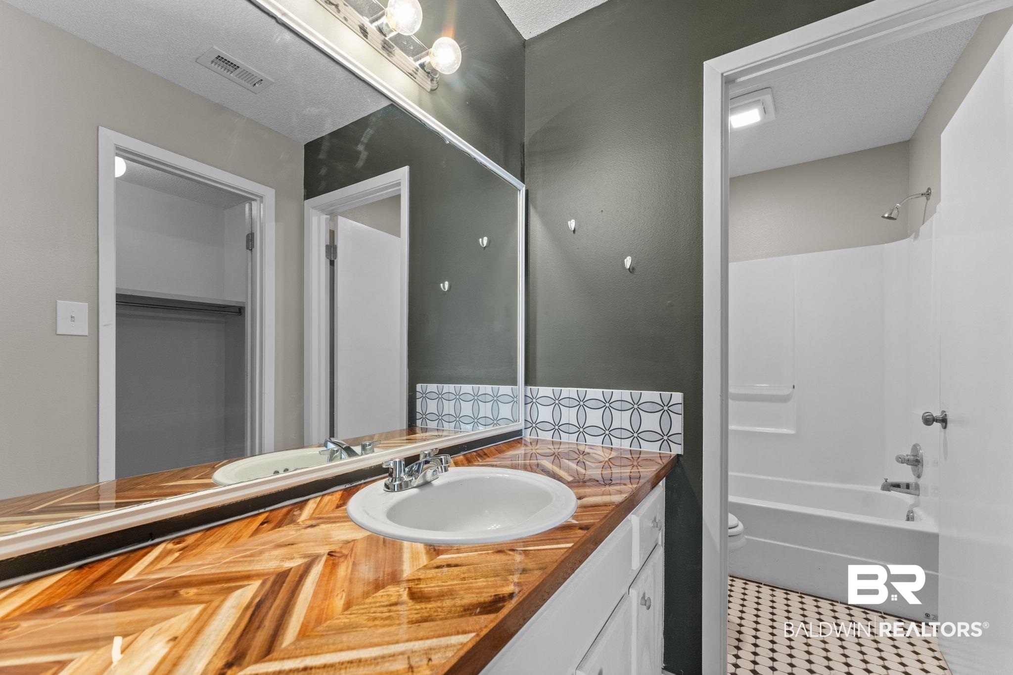 128 West Satsuma Avenue, Unit 128 Foley, AL 36535 - Photo 21 of 41 Bathroom featuring vanity and tub / shower combination