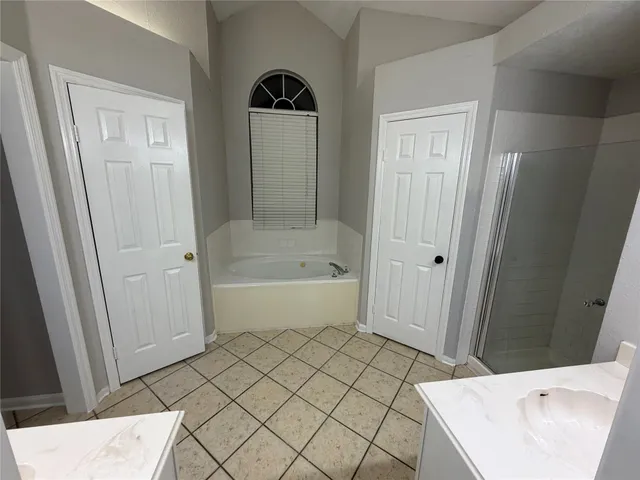 a bathroom with a bathtub and shower