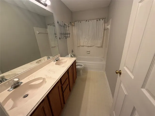 a bathroom with a sink a mirror and a shower