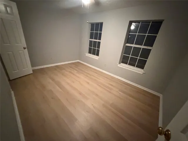 a view of empty room with windows