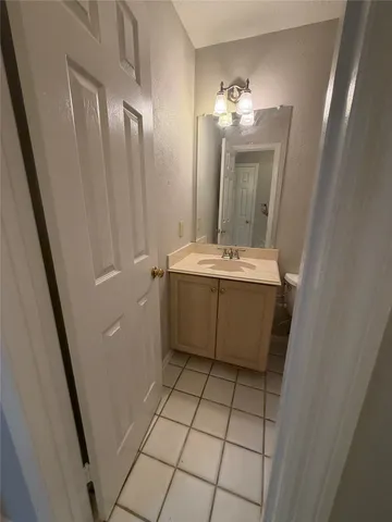 a bathroom with a sink a vanity and a mirror