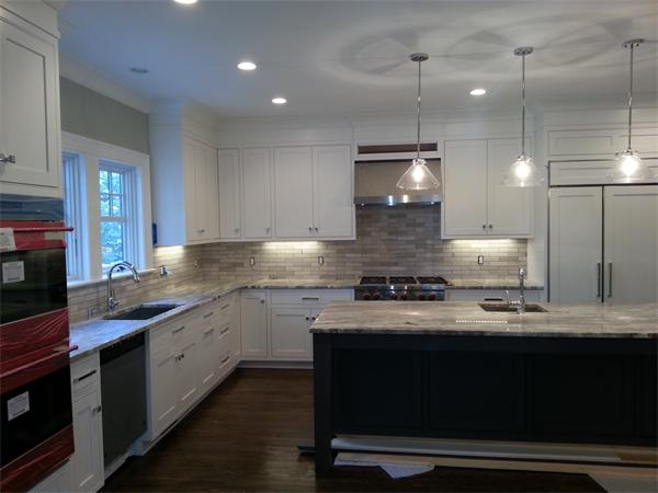 Lot 116 The Ridge Newton, MA 02459 - Photo 6 of 9 a kitchen with a stove and a sink