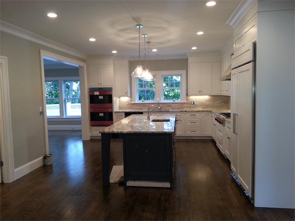 Lot 116 The Ridge Newton, MA 02459 - Photo 8 of 9 a kitchen with stainless steel appliances granite countertop a refrigerator a sink dishwasher a stove and a dining table with wooden floor