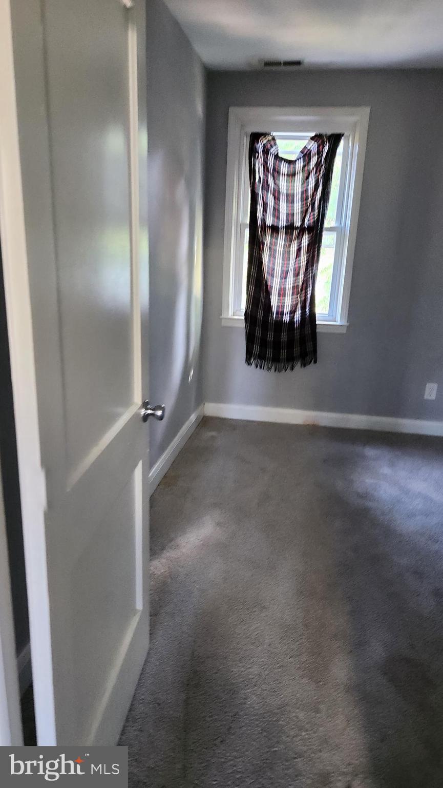 1024 Wicklow Road Baltimore, MD 21229 - Photo 12 of 44 an empty room with windows and closet